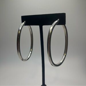 Over sized sterling silver oval hoop earrings for pierced ears. Light weight.